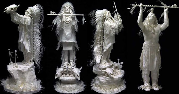 Red Indian heads performing rituals in paper sculptures